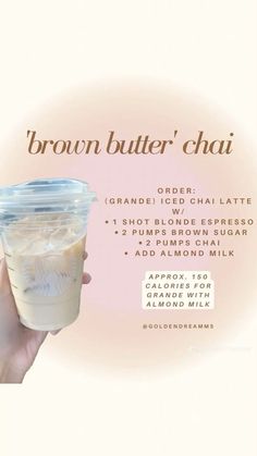 a person holding up a drink in front of a pink and white background with the words brown butter chai