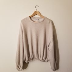 Incredibly Comfortable And Stylish, This Oversized Zara Sweatshirt Is Perfect For Any Closet. Features A Soft Cream Color With Light Ribbing Throughout The Body. Includes Nice Elastic Trim On The Bottom And Each Sleeve, Giving It A Good Amount Of Stretch For The Perfect Fit. Pairs Perfectly With Your Favorite Pair Of Jeans Or Tucked Into A Skirt! 54% Polyester And 46% Cotton For An Ultra Soft Feel. Brand New With Tags! Size Medium. Oversized Ribbed Cropped Sweater With Crew Neck, Oversized Ribbed Crew Neck Cropped Sweater, Beige Soft Knit Crew Neck Top, Casual Ribbed Sweater With Balloon Sleeves, Beige Tops With Ribbed Cuffs For Fall, Casual Long Sleeve Knit Top With Ribbed Cuffs, Oversized Ribbed Cropped Cotton Sweater, Cozy Drop Shoulder Tops For Layering, Cozy Knit Top With Balloon Sleeves