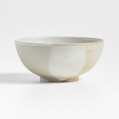 a white bowl sitting on top of a table