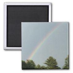 a rainbow in the sky with trees and clouds refrigerator magnets on a white background