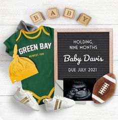 baby announcement with football jersey, booties and other items