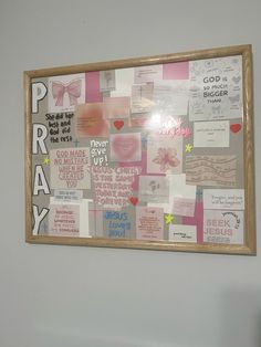 a bulletin board is covered with notes and magnets on the wall next to a chair