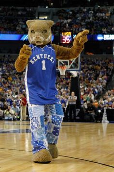 a mascot is walking on the basketball court