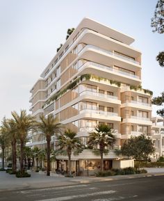 an artist's rendering of a building with balconies and palm trees on the street