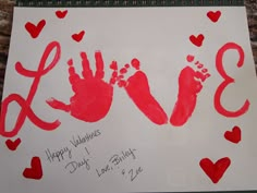 a hand and foot print on a sheet of paper that says happy valentine's day