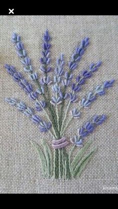 a close up of a piece of cloth with lavender flowers on it and text that reads,