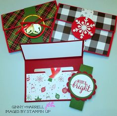 three envelopes with christmas cards and tags attached to the front, on top of each other