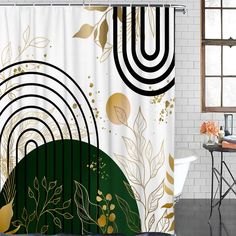 the shower curtain is decorated with gold and black designs on white brick walls, along with a round table in front of it