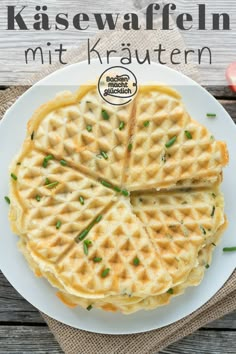 a white plate topped with waffles on top of a wooden table