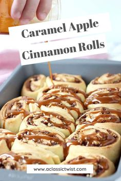 caramel apple cinnamon rolls in a baking pan with a sign that says caramel apple cinnamon rolls