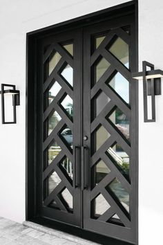 a black double door with glass panels on the front and side doors to both sides