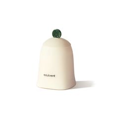 a small white bell with a green decoration on it's top and the word poulaventt written in black