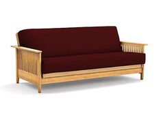 a wooden couch with a red cover on it's back and armrests