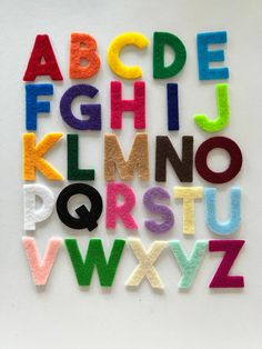 the letters are made out of felt and have different colors