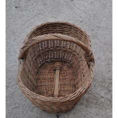 a wicker basket sitting on the ground