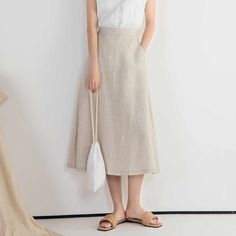 "DETAIL * 100% Linen * Back elastic * Two side pockets * A Line skirt * Below knee length skirt * Wash by hand or machine with cold water * The model is 170cm (5′ 7″) tall with a 66cm (26\") waist. She is wearing a XS/S in natural color. * Choose CUSTOM Order if you Need a better fit Can't find your size in our size Chart Change the Style Chang the Length Your Height is not Between 5'1\" - 5\"9\" SIZING AND FIT, Garment size as follow XS/S Waist 66-71cm Hips 100cm Length 75cm Weight suggest with Chic Long Pencil Skirt With Pockets, Spring Solid Color Midi Bottoms, Summer Bottoms With Pockets, Midi Length, Solid Color Midi Skirt For Summer, Casual Spring Pencil Skirt With Pockets, Summer Solid Color Midi Skirt, Casual Pencil Skirt With Pockets For Spring, Summer Pencil Skirt With Side Pockets, Chic Summer Skirt With Pockets