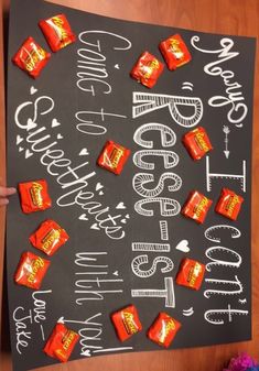 a chalk board with candy bars on it