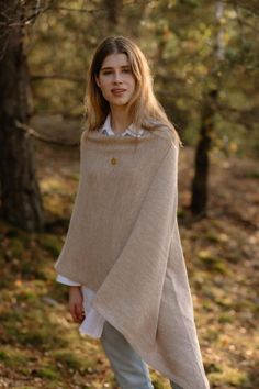 This hand knitted cape feels like warm and cosy hug. Soft merino, alpaca and mohair wool blend will keep body in perfect temperature. Due to natural wool advantages this pullover blanket sweater is ideal for all seasons. Hand knitted women's poncho is great for long walks in the forest, outdoor activity and resting at home. It's so versatily because you can wear it as a sweater on the top of other layers or on the jacket, even coat.  Oversized knit poncho could be amazing Christmas gift! One size knitted wool poncho fits most sizes. Please contact me if you need special one. Composition: 40% merino wool, 30% alpaca wool, 30% mohair wool Lady in the picture is 180 cm / 5.7 feet height Care instructions:  * Hand wash, 30 degrees C (85 degrees F) * Dry flat * Iron low heat * Do not bleach * D Cozy Alpaca Cape For Winter, Cozy Alpaca Poncho For Winter, Winter Alpaca Cape Poncho, Winter Alpaca Poncho Cape, One Size Alpaca Poncho, Cozy Wool Poncho Cape, Cozy Alpaca Shawl For Winter, Beige Alpaca Poncho For Winter, Winter Beige Alpaca Poncho