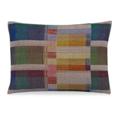 the multicolored plaid pillow is shown on an isolated white background and has a square pattern