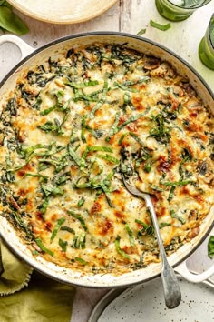 a casserole dish with spinach and cheese