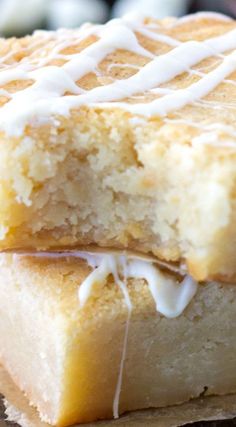 two pieces of cake sitting on top of a wooden table