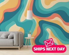 a couch sitting in front of a wall with an envelope on it and the words ships next day