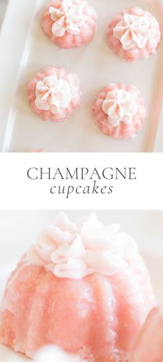 pink cupcakes with white frosting and flowers on top are sitting in a pan