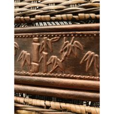 an old woven basket with carvings on it