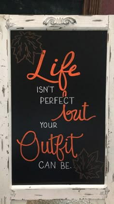 a chalkboard sign that says life isn't perfect but your quitt can be