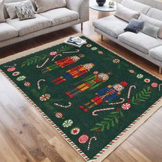 a living room area with couches and rugs on the floor, decorated in christmas decorations