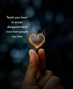 someone holding a heart shaped object in their hand with the words teach your heart to accept disappointments even from people you love