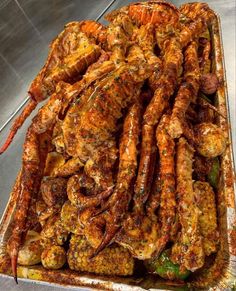 there is a tray full of cooked shrimp