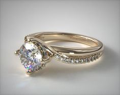 a white gold engagement ring set with an oval cut diamond