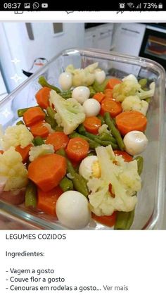 a plastic container filled with carrots, celery and onions