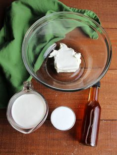 the ingredients to make an ice cream dessert are shown in bowls on a wooden table