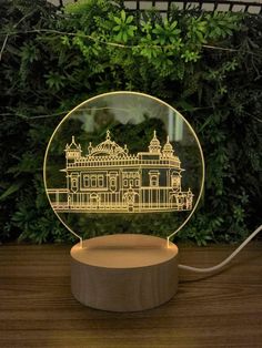 a glass ball with an image of a building in the center on top of a wooden stand