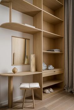 a wooden desk and shelves in a room