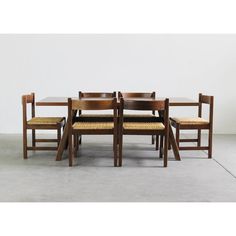 a set of four chairs and a table