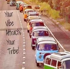 a long line of cars driving down a road with the words your vibe attracts your tribe