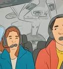 two people are sitting in the back seat of a car and one is talking on a phone