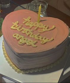 a heart shaped cake with the words happy birthday on it