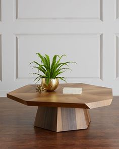 a wooden table with a potted plant on top