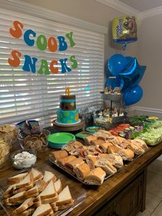 an assortment of snacks and desserts on a table