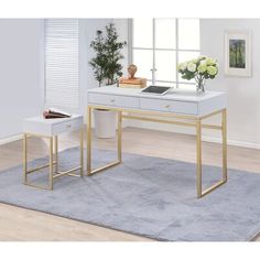 two white desks with gold legs in front of a window and rug on the floor