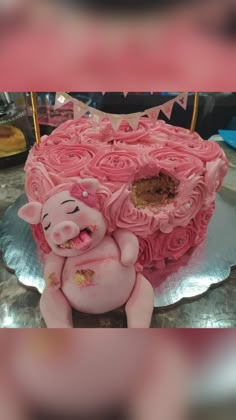 a cake shaped like a pig laying on top of a table