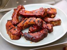 the plate has meat on it and is ready to be cooked in the oven or used as an appetizer