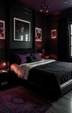 a bedroom with black walls and pictures on the wall above the bed is lit by candles