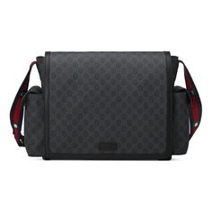 a black and red gucci bag with the strap down to it's shoulder