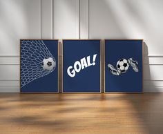 three soccer posters with the words goal and ball in front of them on a wooden floor