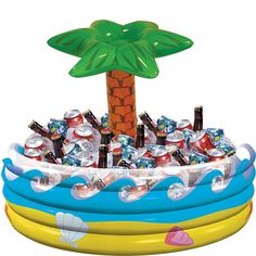 an inflatable pool with a palm tree on top and lots of sodas